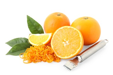 Photo of Pile of fresh orange zest, fruits, leaves and grater isolated on white