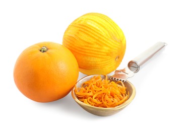 Photo of Fresh orange zest in bowl, fruits and zester isolated on white