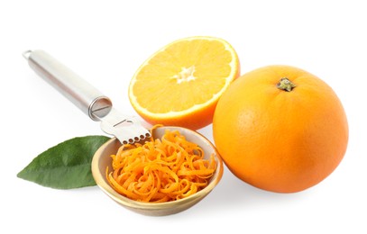 Photo of Fresh orange zest in bowl, fruits and zester isolated on white