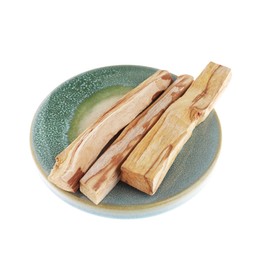 Photo of Three palo santo sticks on white background