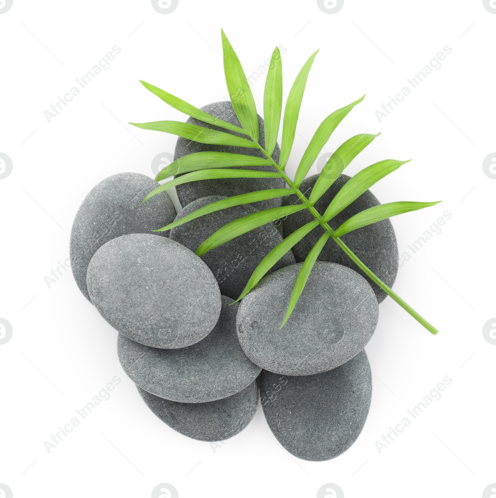 Photo of Spa stones with leaves isolated on white, top view