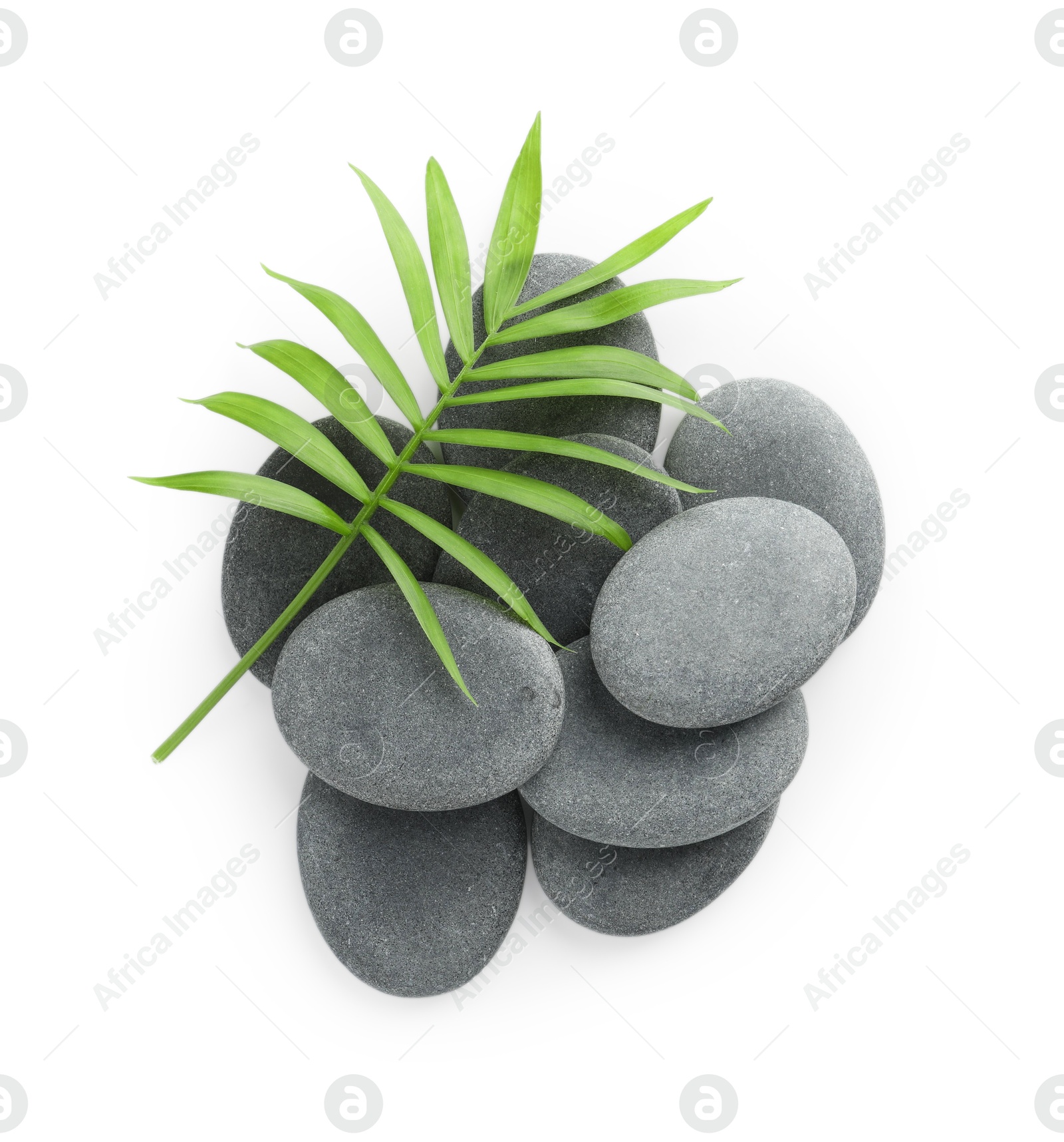 Photo of Spa stones with leaves isolated on white, top view