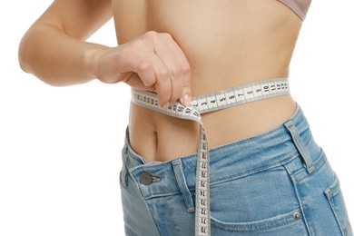 Photo of Woman measuring waist circumference on white background, closeup