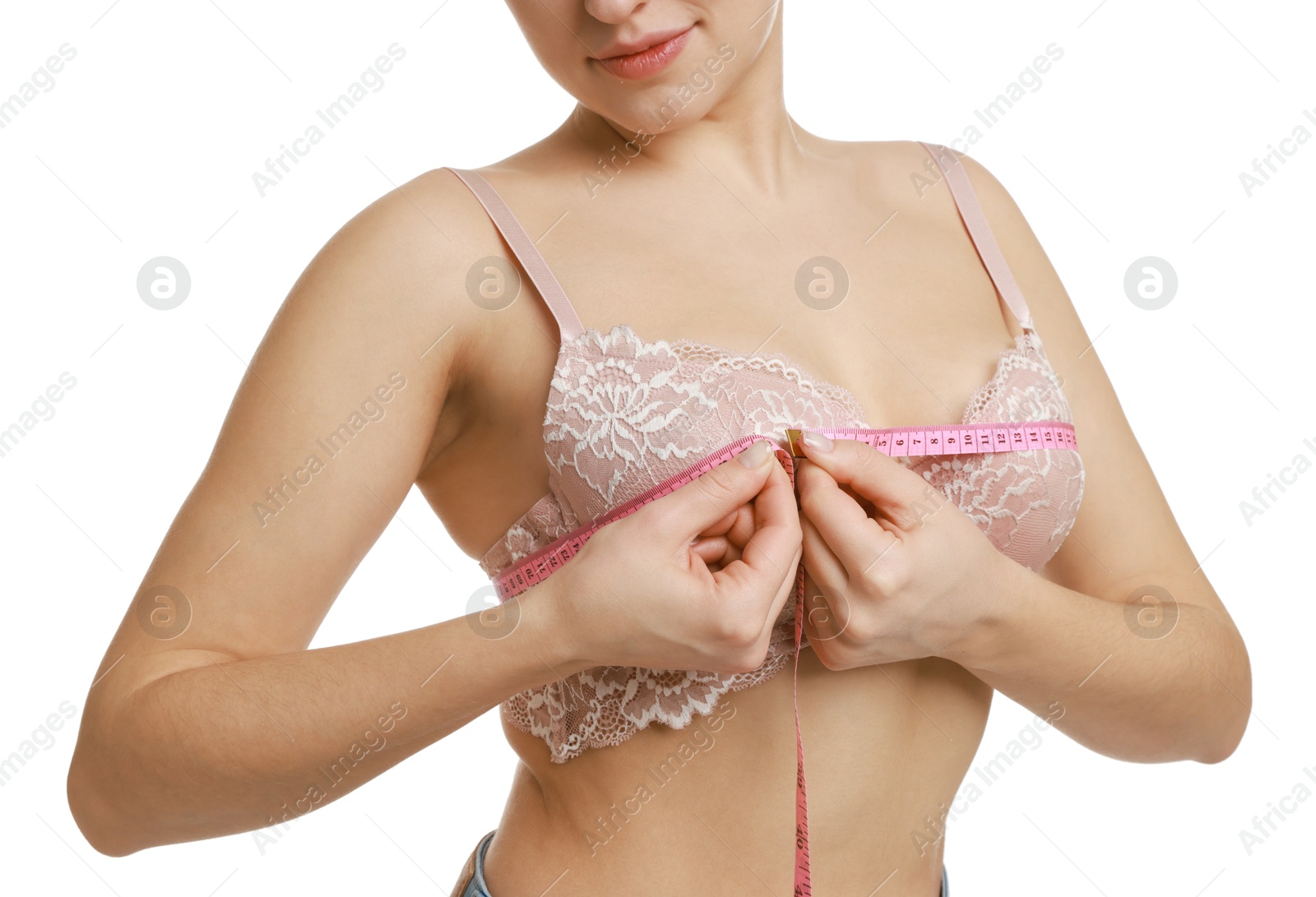 Photo of Woman in beautiful bra measuring breast circumference on white background, closeup