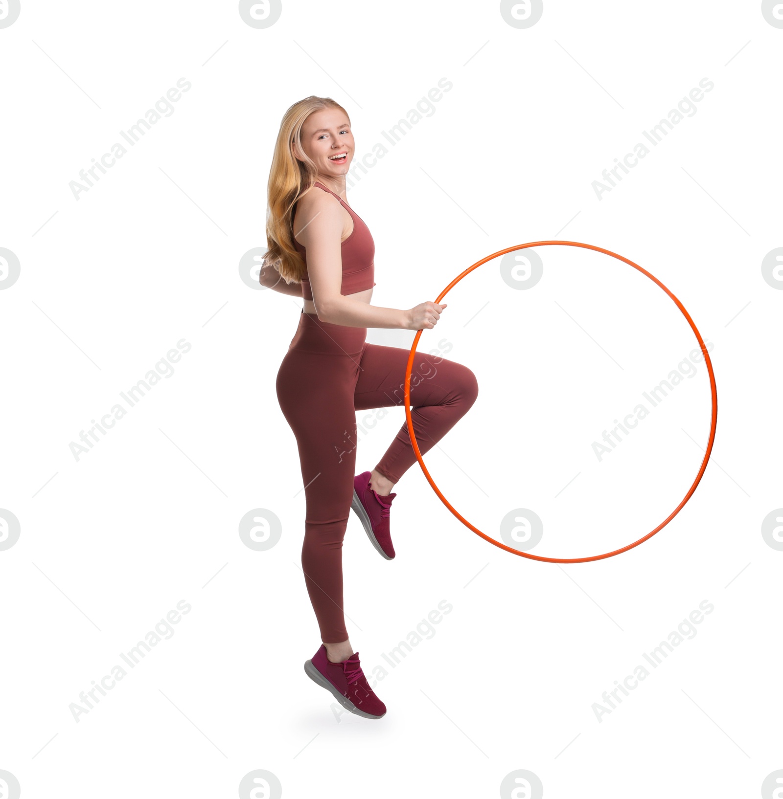 Photo of Beautiful young woman exercising with hula hoop on white background