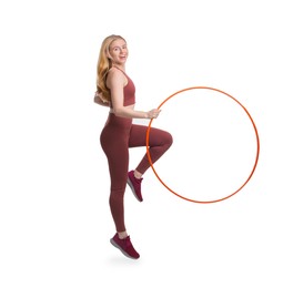 Photo of Beautiful young woman exercising with hula hoop on white background