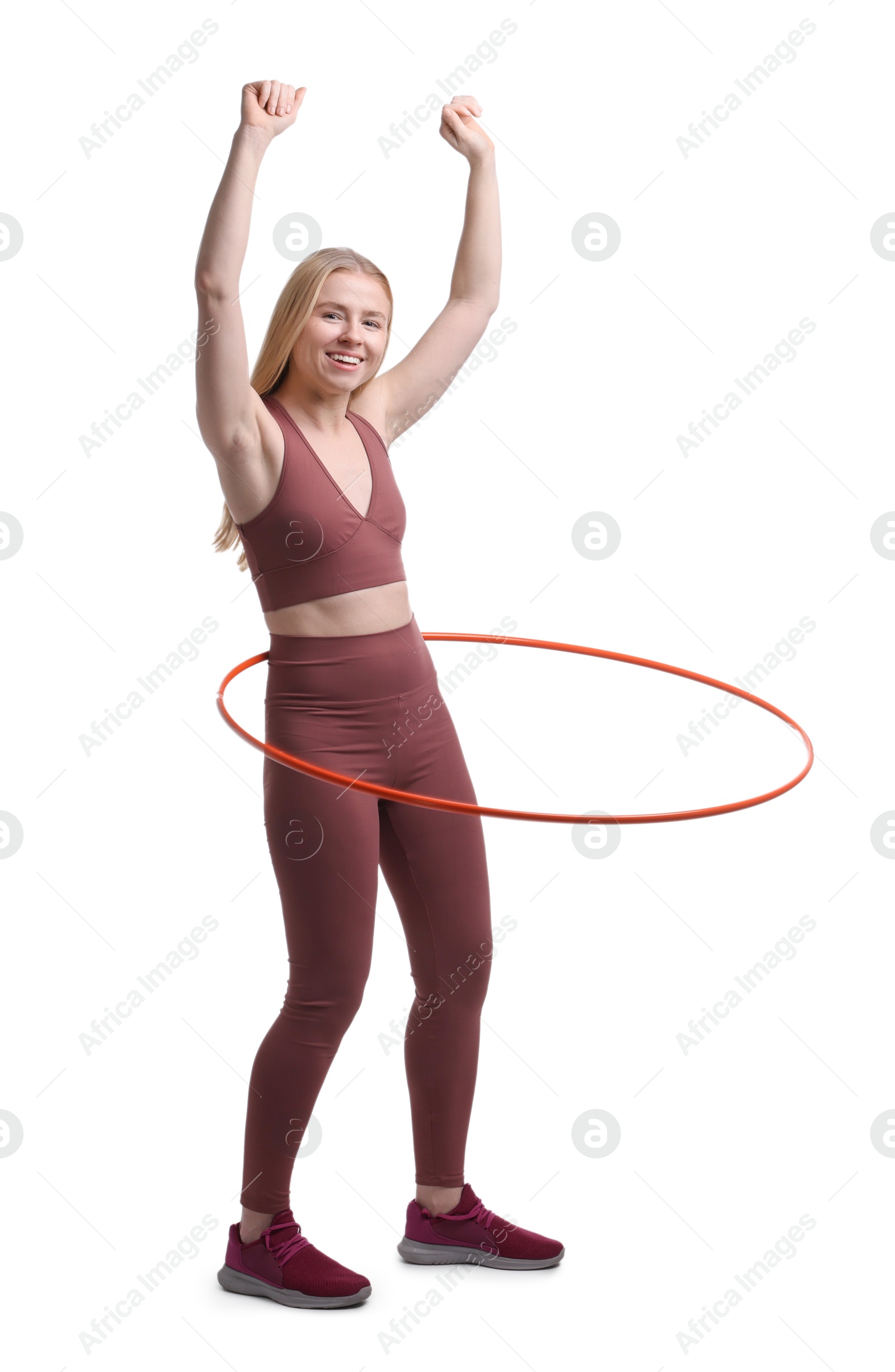 Photo of Beautiful young woman exercising with hula hoop on white background