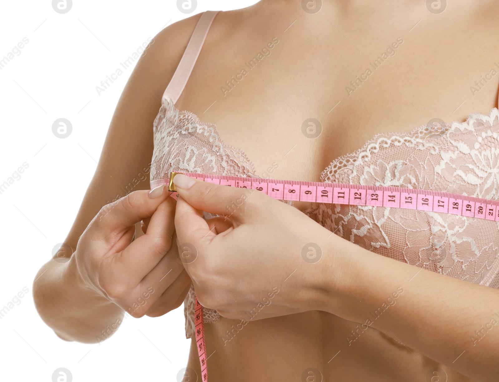 Photo of Woman in beautiful bra measuring breast circumference on white background, closeup