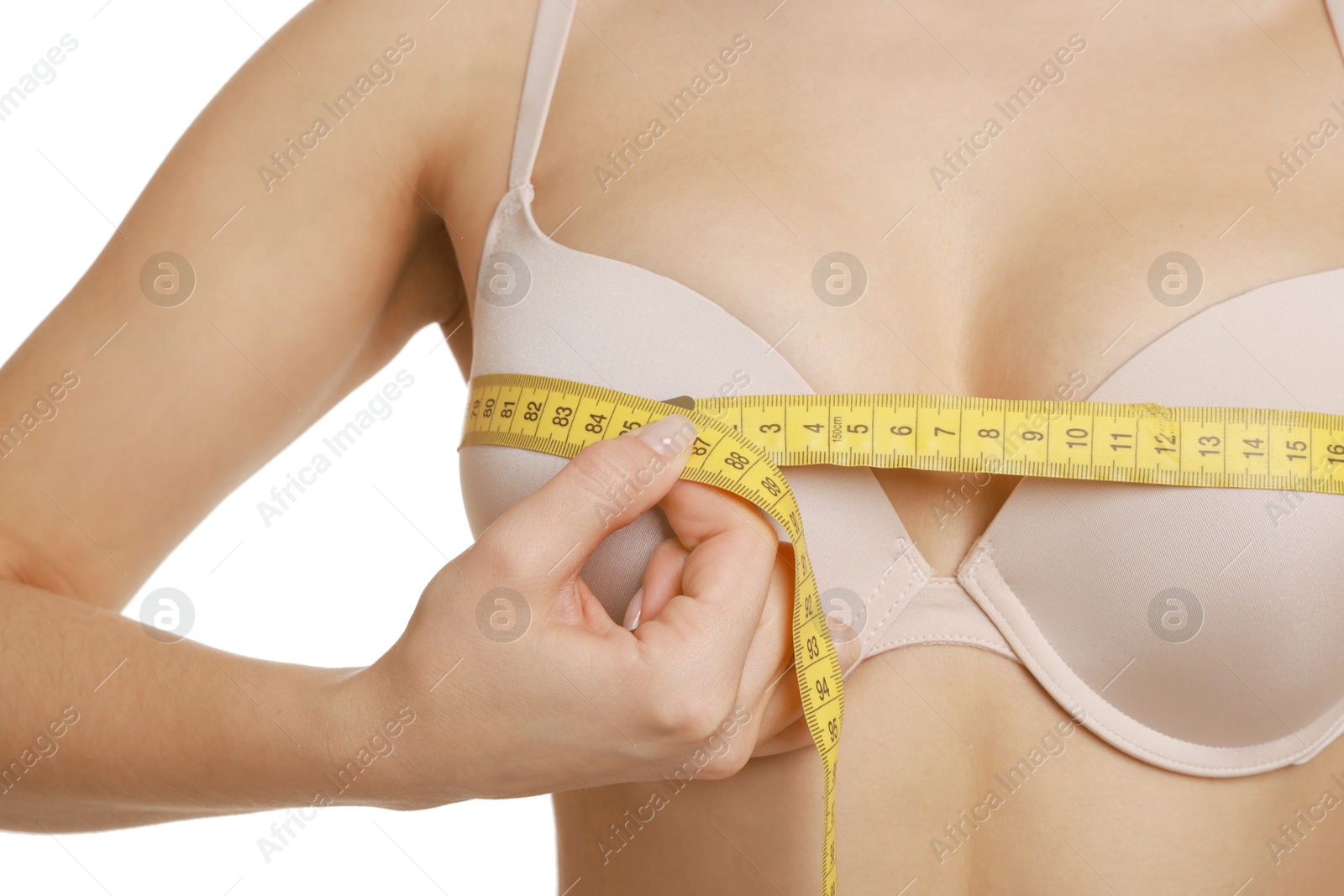 Photo of Woman in beautiful bra measuring breast circumference on white background, closeup