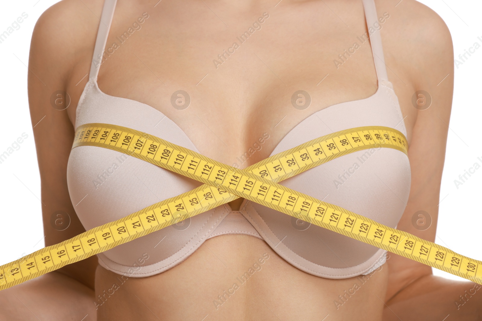 Photo of Woman in beautiful bra measuring breast circumference on white background, closeup