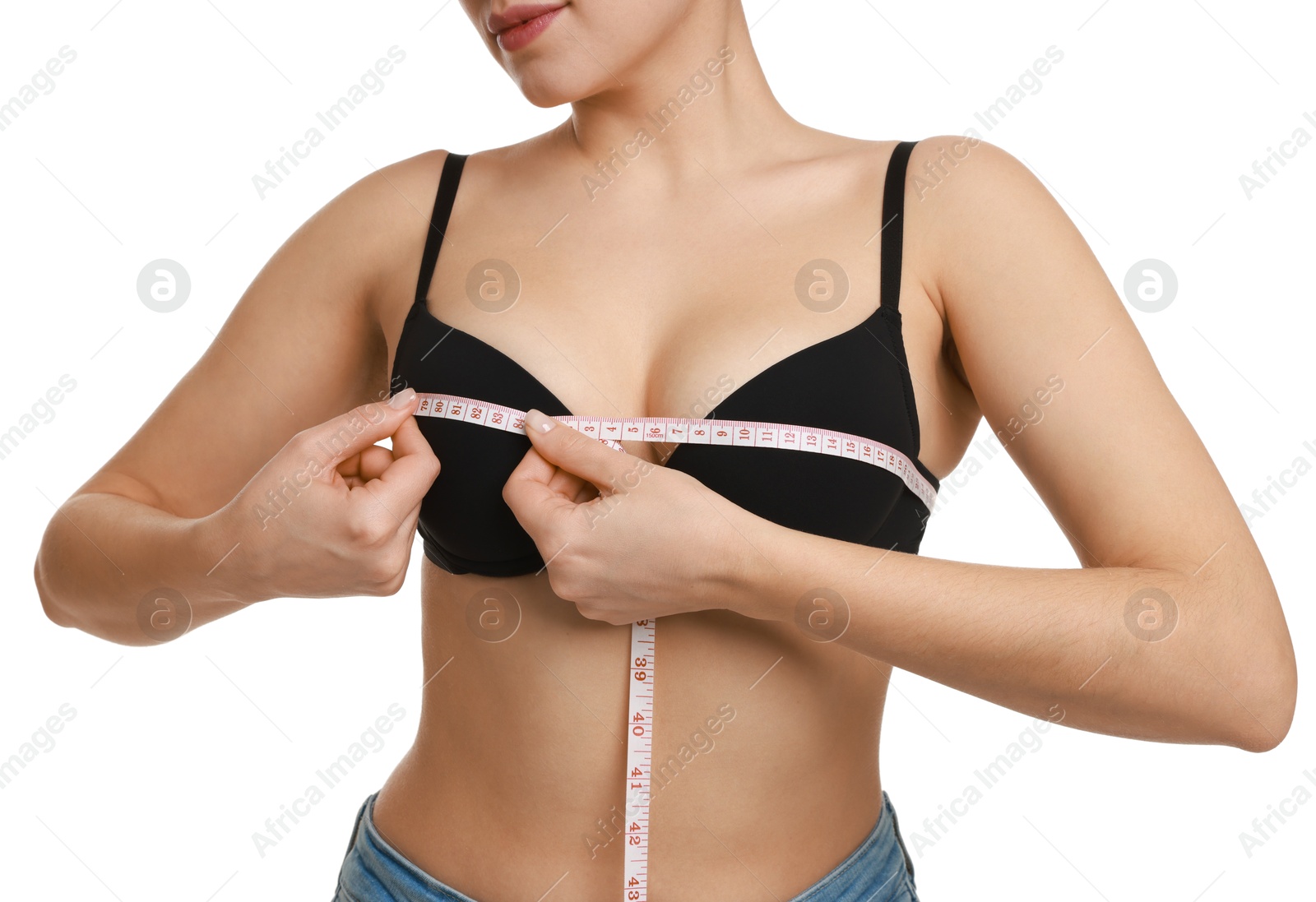 Photo of Woman in beautiful bra measuring breast circumference on white background, closeup