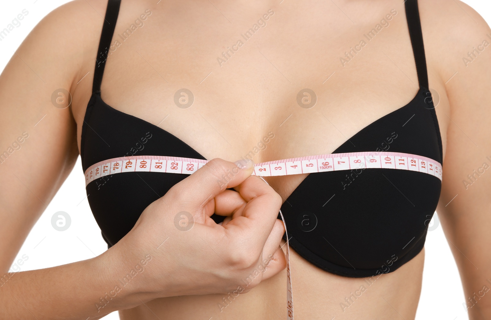 Photo of Woman in beautiful bra measuring breast circumference on white background, closeup