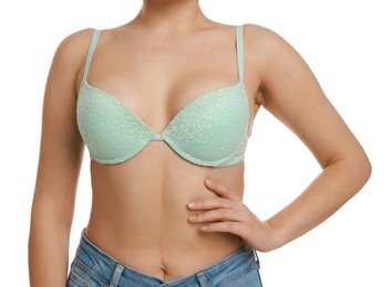 Photo of Woman wearing beautiful bra on white background, closeup