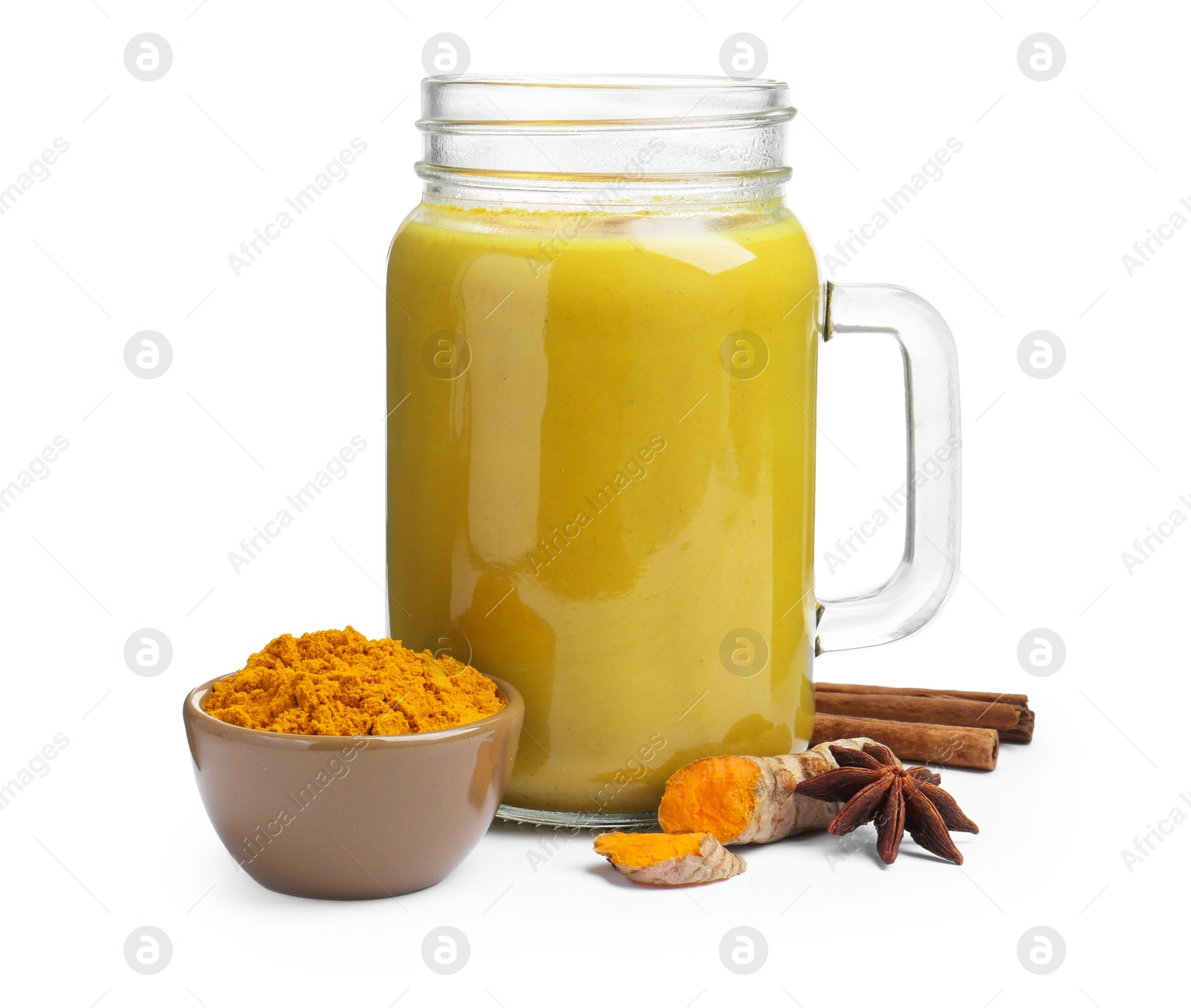 Photo of Delicious turmeric latte in mason jar and spices isolated on white