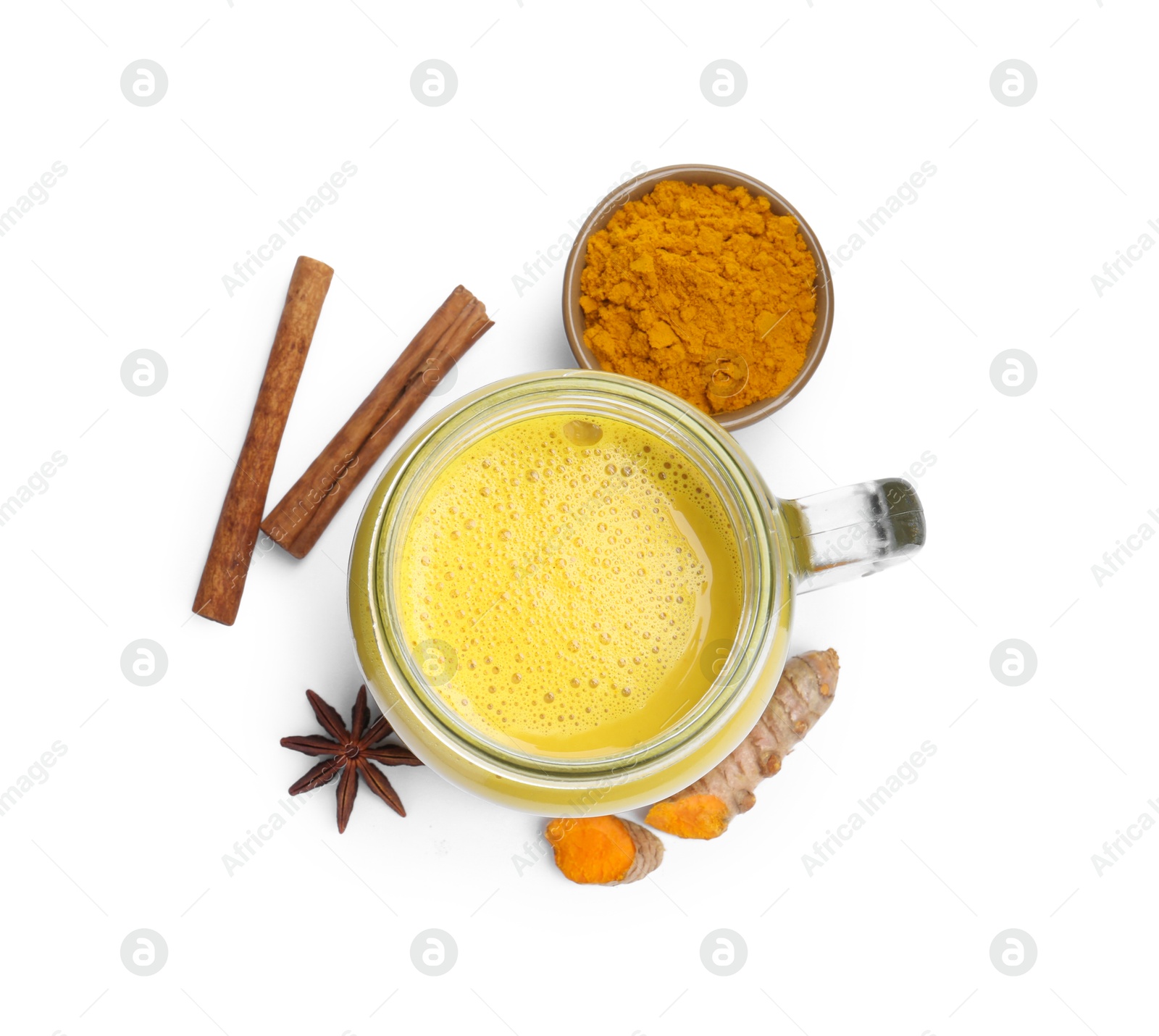 Photo of Delicious turmeric latte in mason jar and spices isolated on white, top view