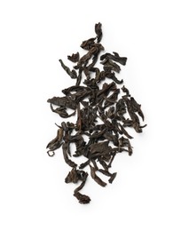 Photo of Pile of dry tea leaves isolated on white, top view