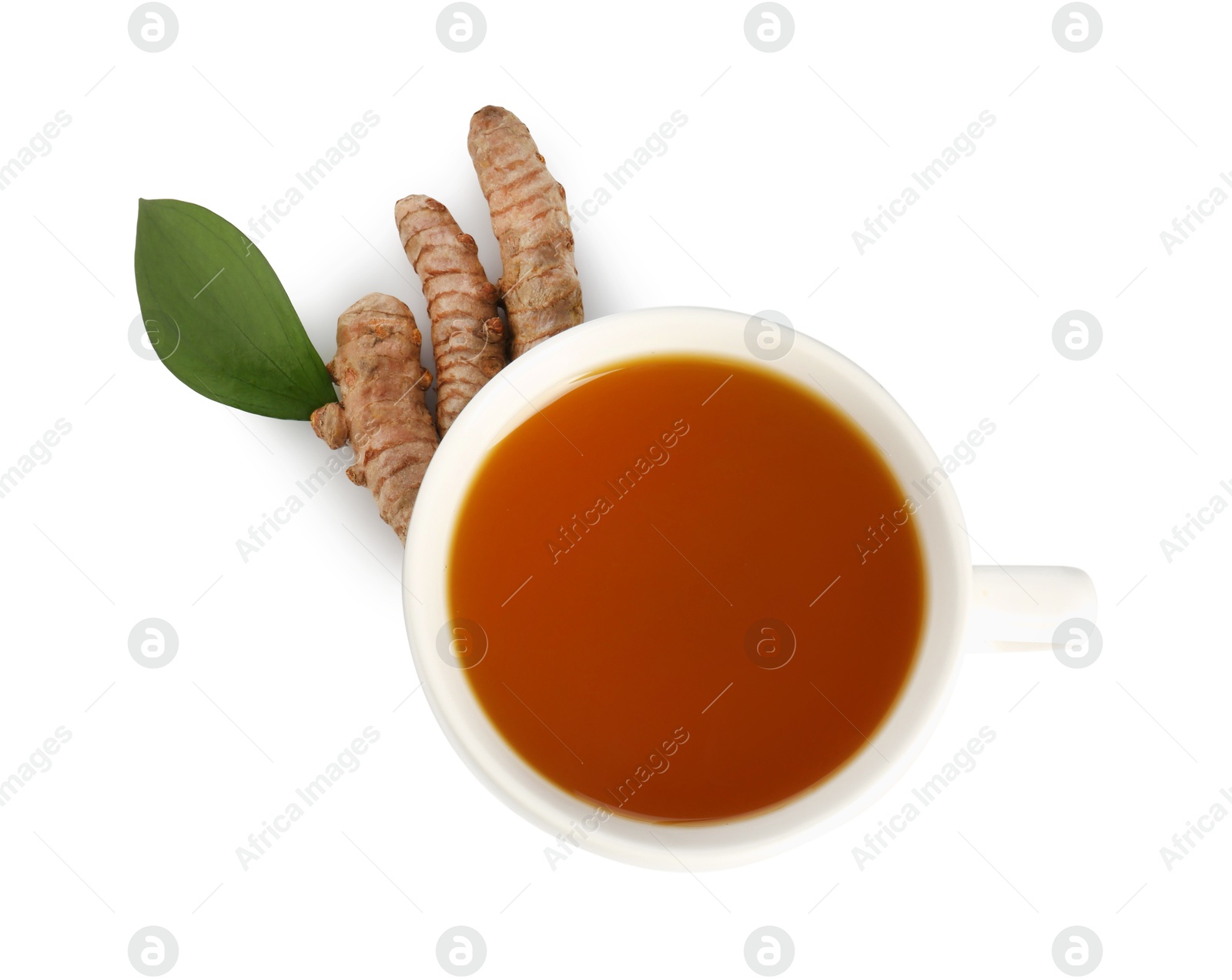 Photo of Aromatic turmeric tea in cup, roots and green leaf isolated on white, top view