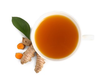 Photo of Aromatic turmeric tea in cup, roots and green leaf isolated on white, top view