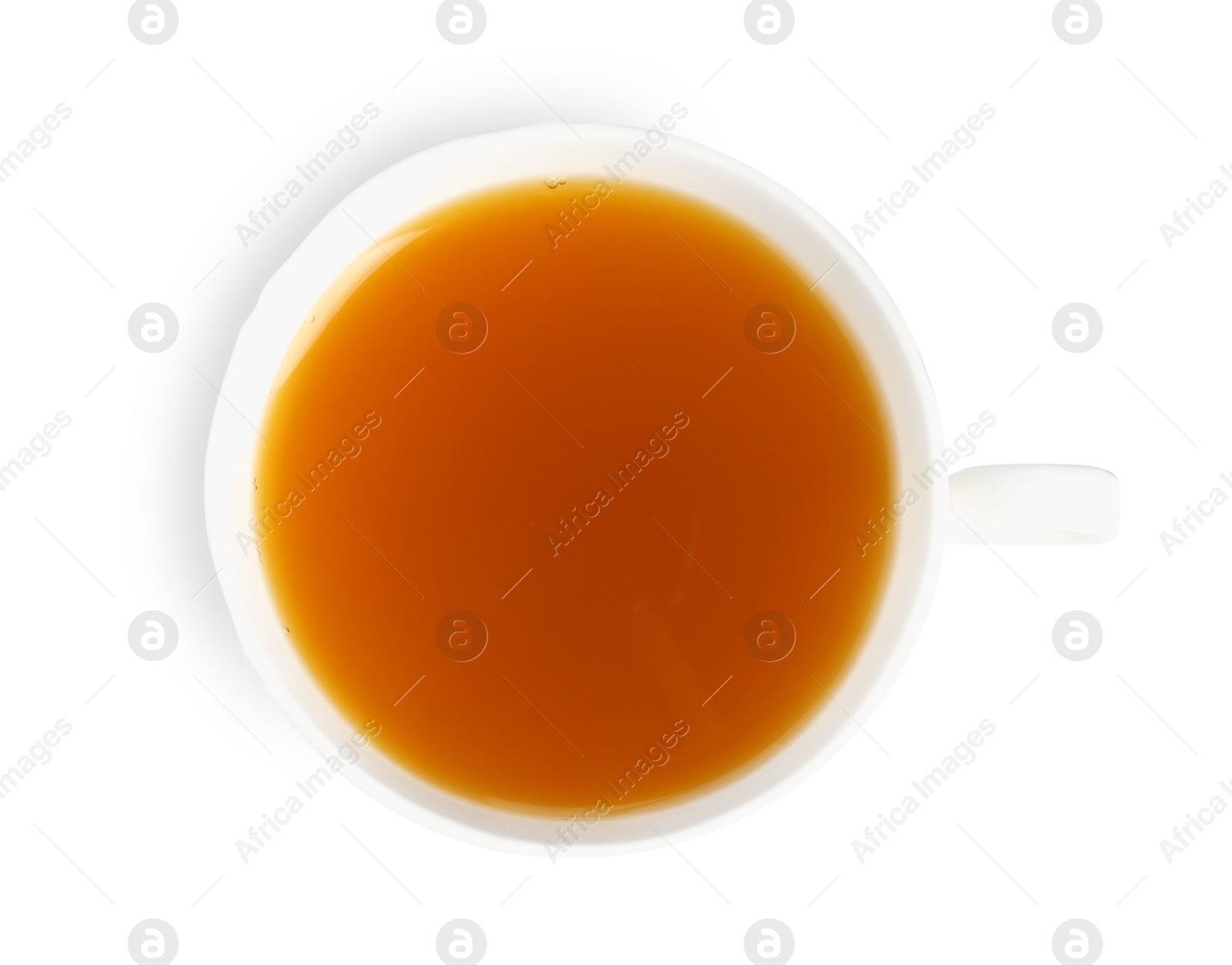 Photo of Aromatic turmeric tea in cup isolated on white, top view