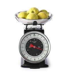 Photo of Retro mechanical kitchen scale with apples isolated on white