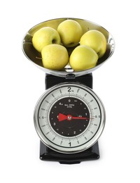 Photo of Retro mechanical kitchen scale with apples isolated on white