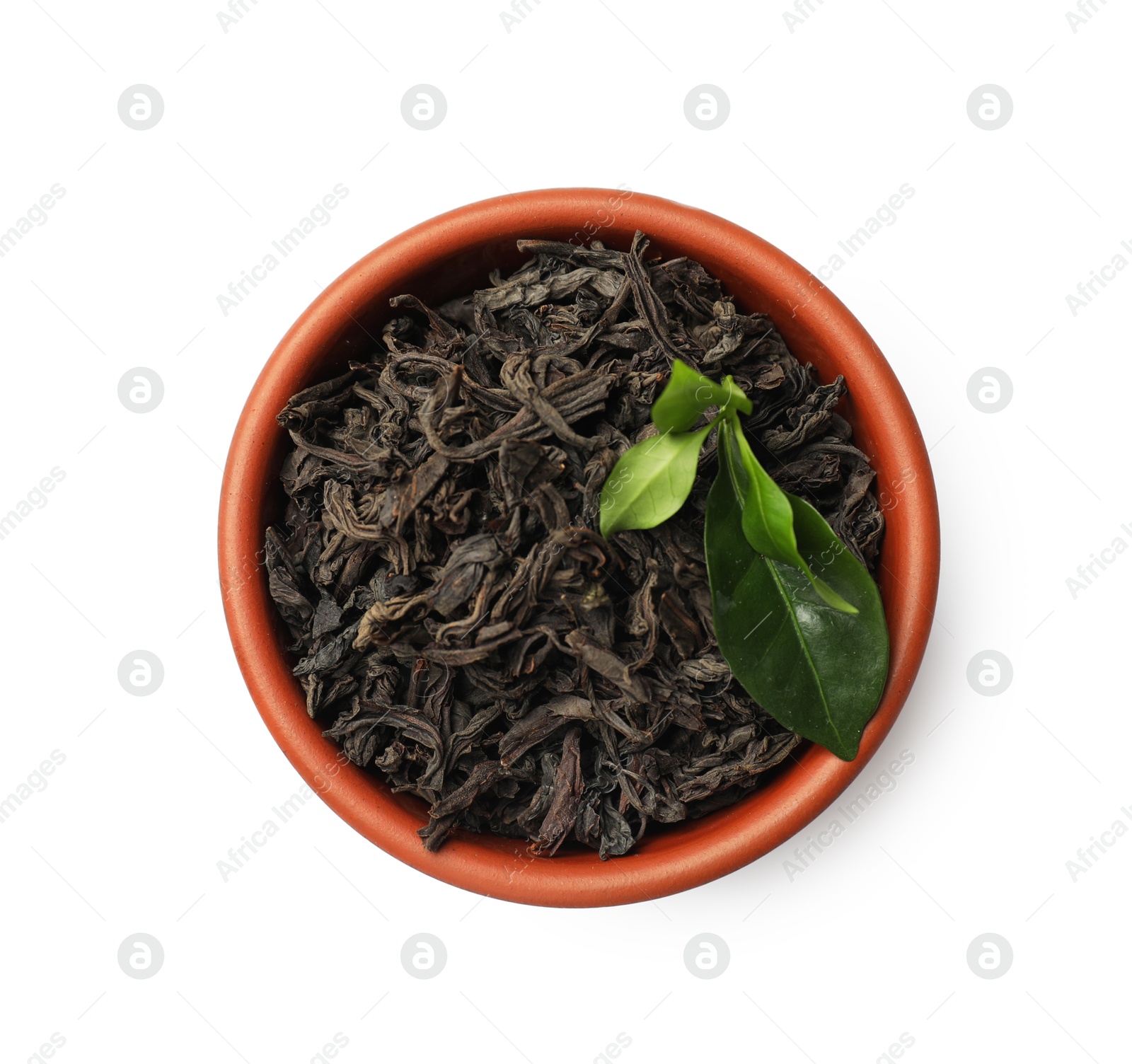 Photo of Dried and fresh tea leaves in bowl isolated on white, top view