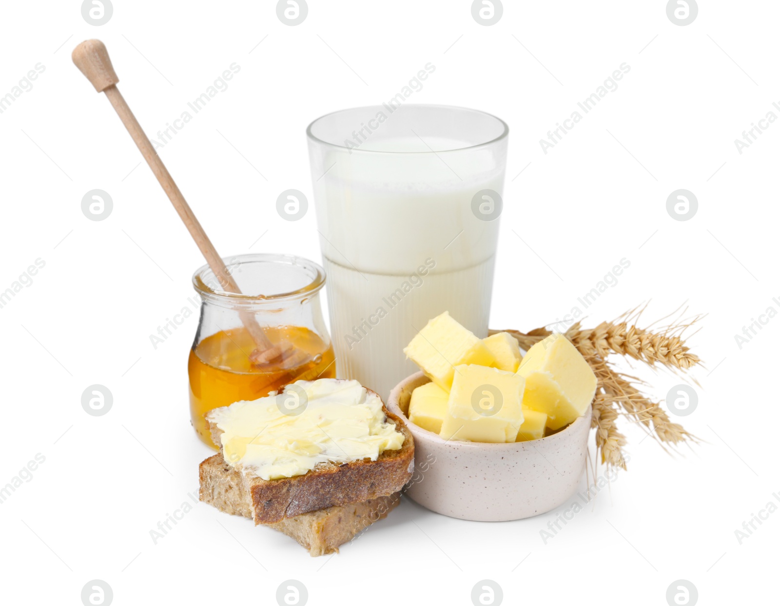 Photo of Tasty sandwich, butter, honey and milk isolated on white