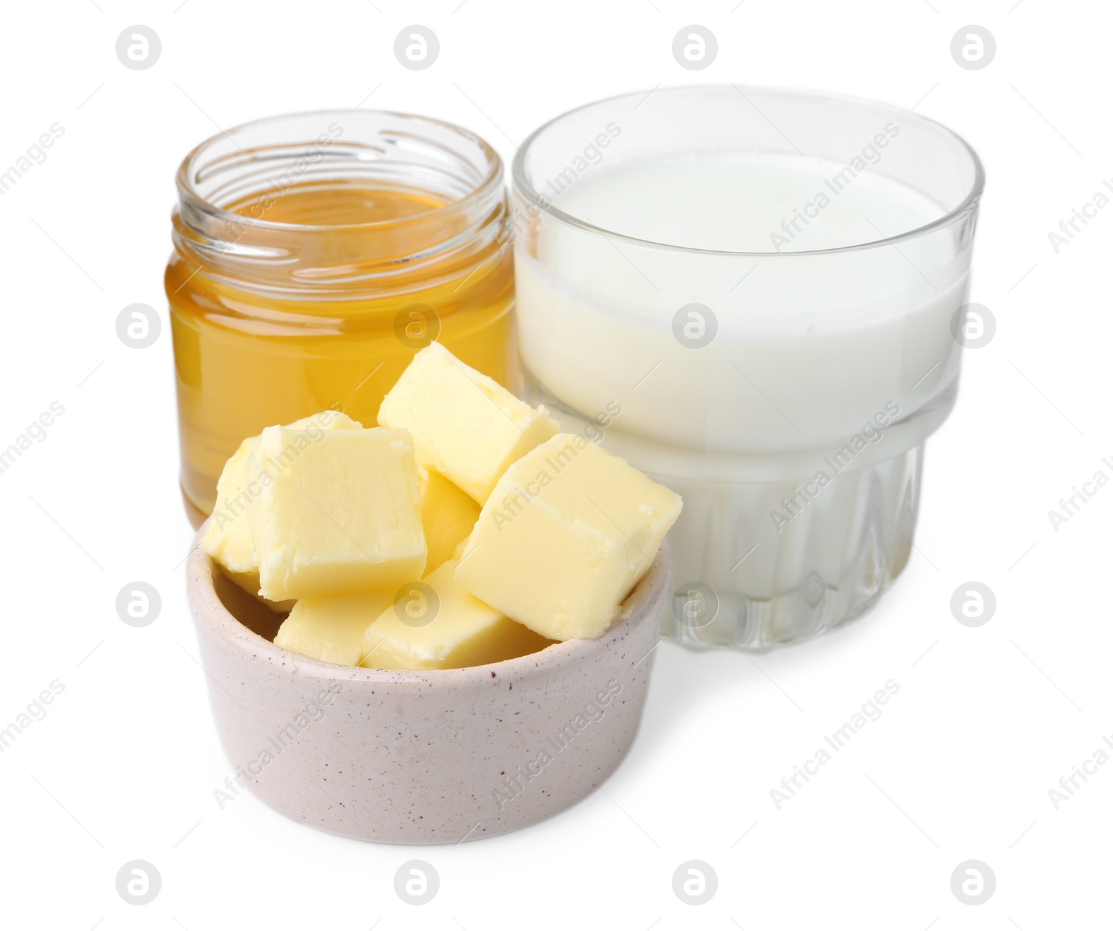 Photo of Sweet honey, butter and milk isolated on white