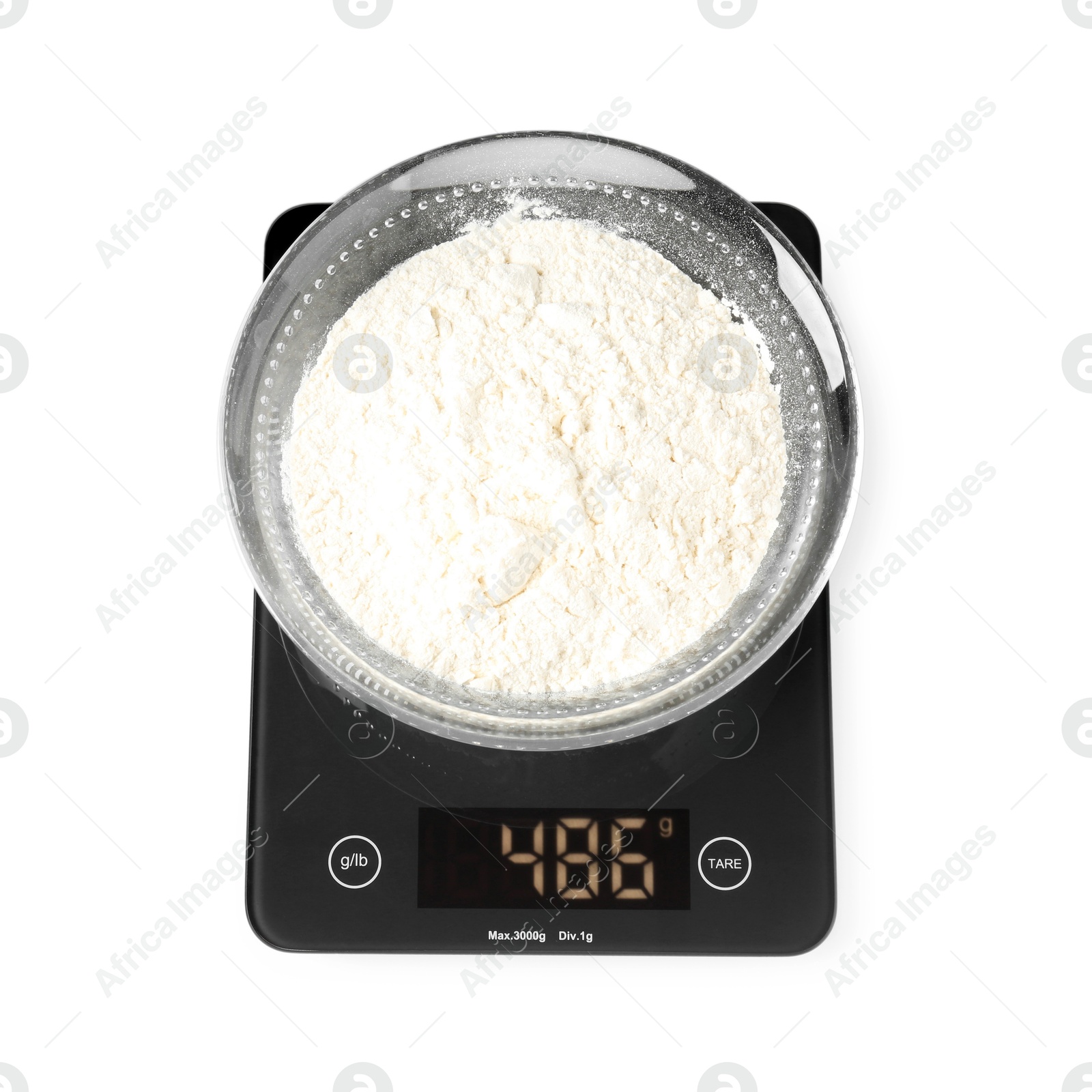 Photo of Modern electronic kitchen scale with flour isolated on white, top view