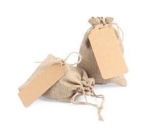 Photo of Two burlap bags with tags isolated on white