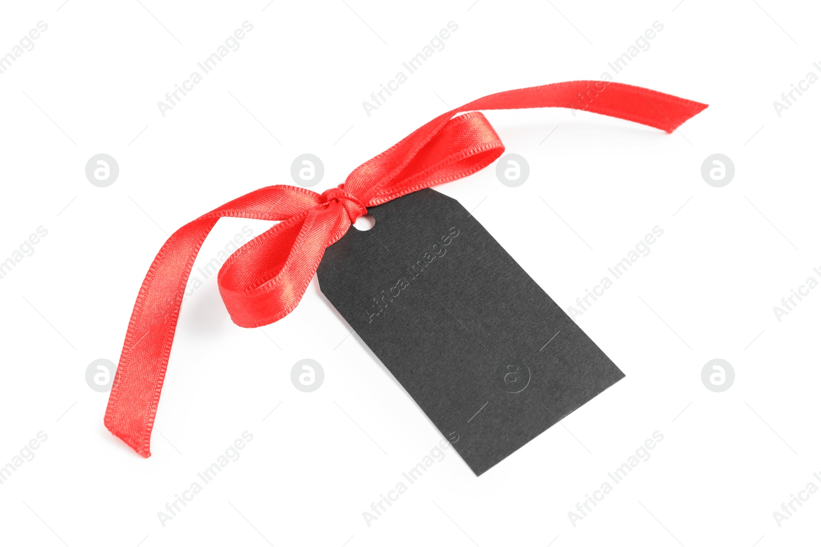 Photo of Blank tag with ribbon bow isolated on white