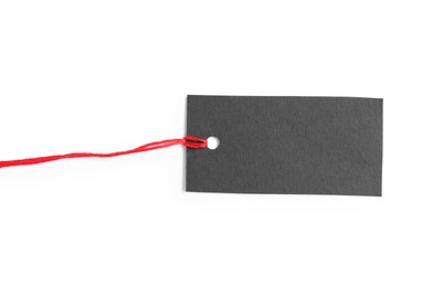 Photo of Blank tag with string isolated on white, top view