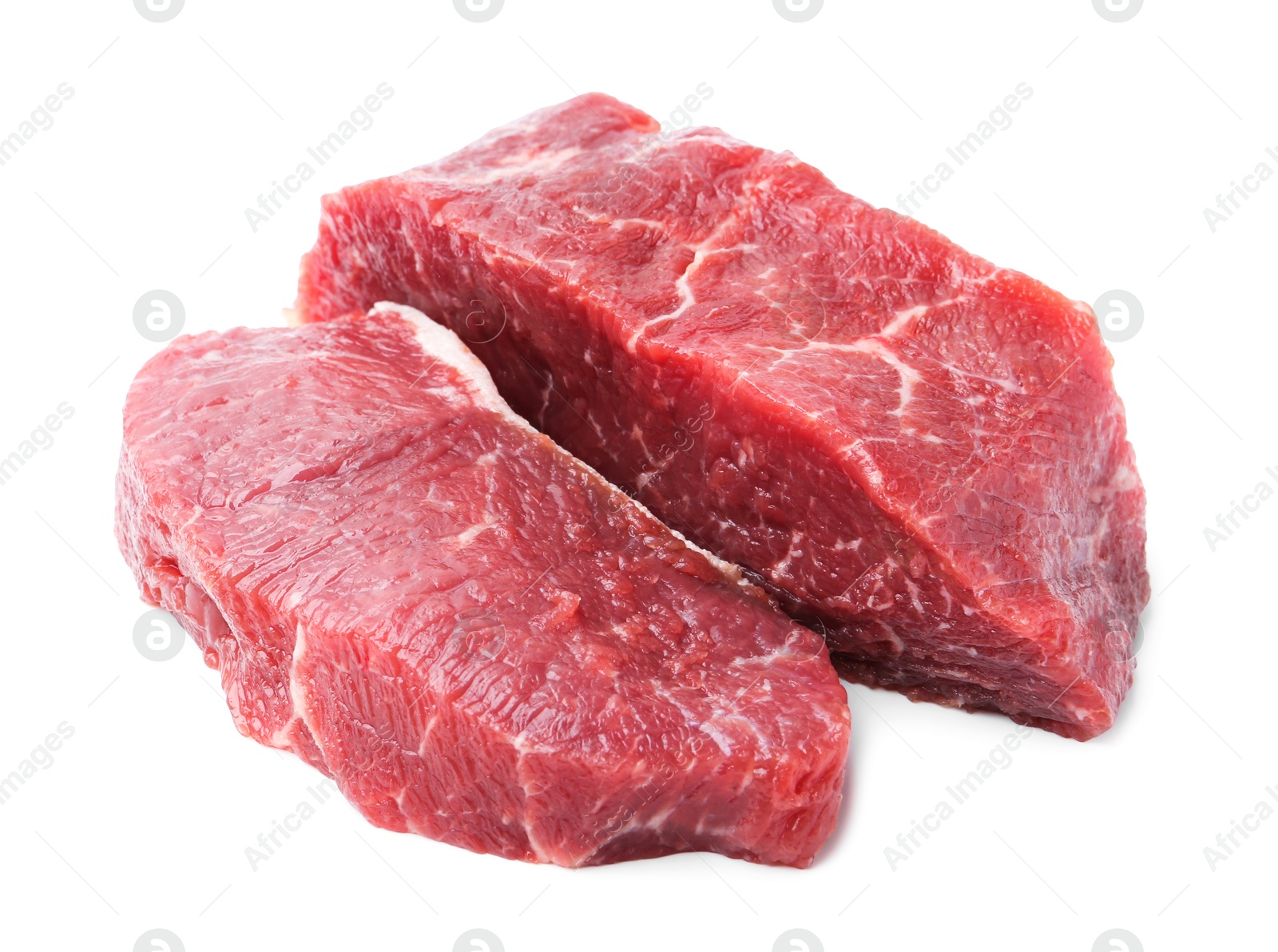 Photo of Pieces of raw beef meat isolated on white