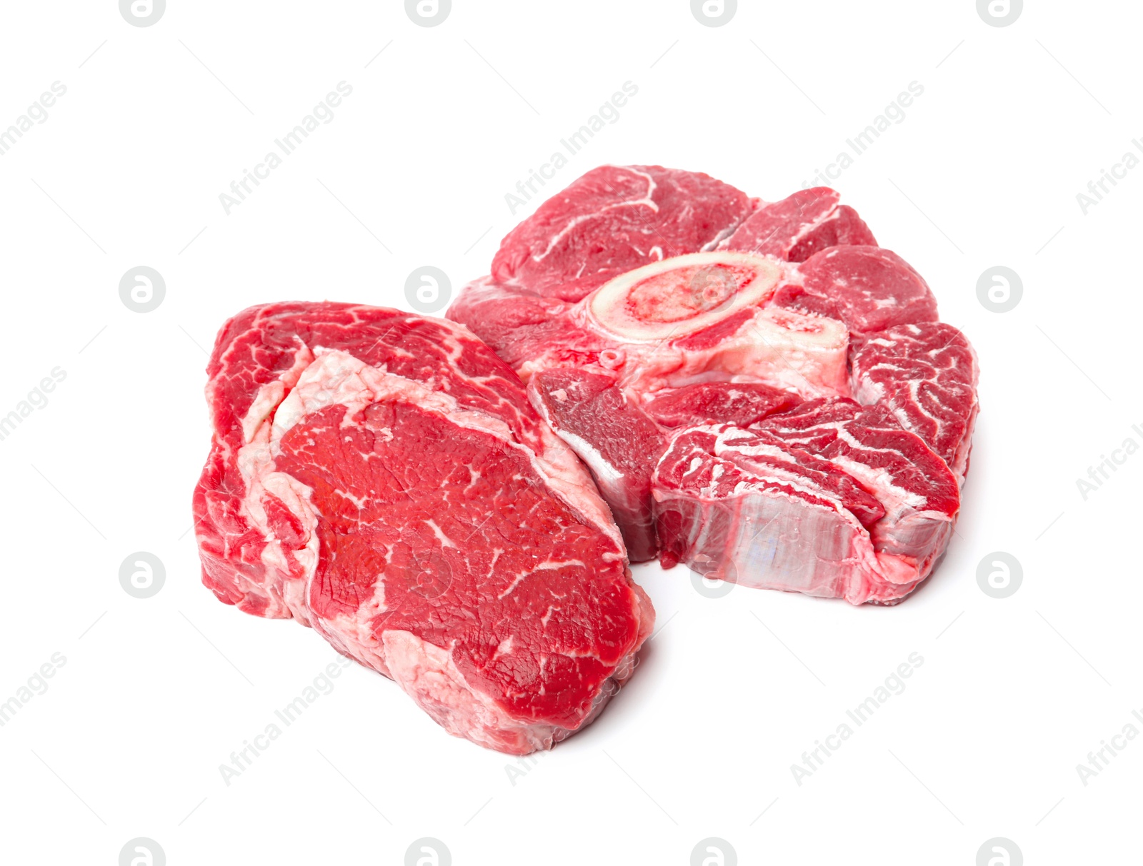 Photo of Pieces of raw beef meat isolated on white