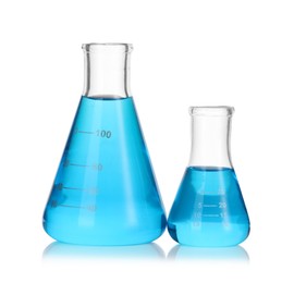 Photo of Flasks with blue liquid isolated on white