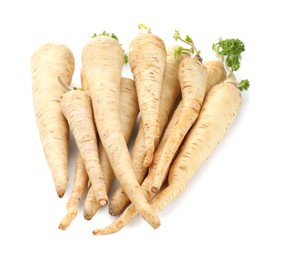 Photo of Many fresh parsley roots isolated on white