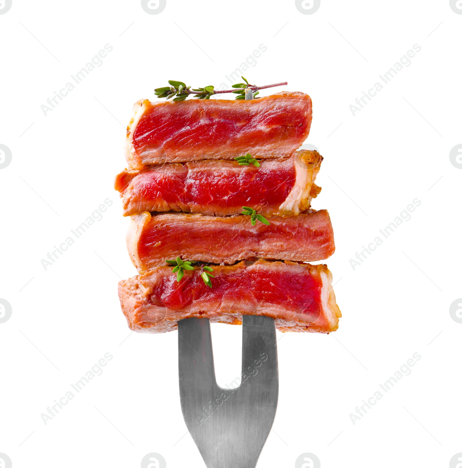 Photo of Carving fork with pieces of delicious beef meat and thyme isolated on white