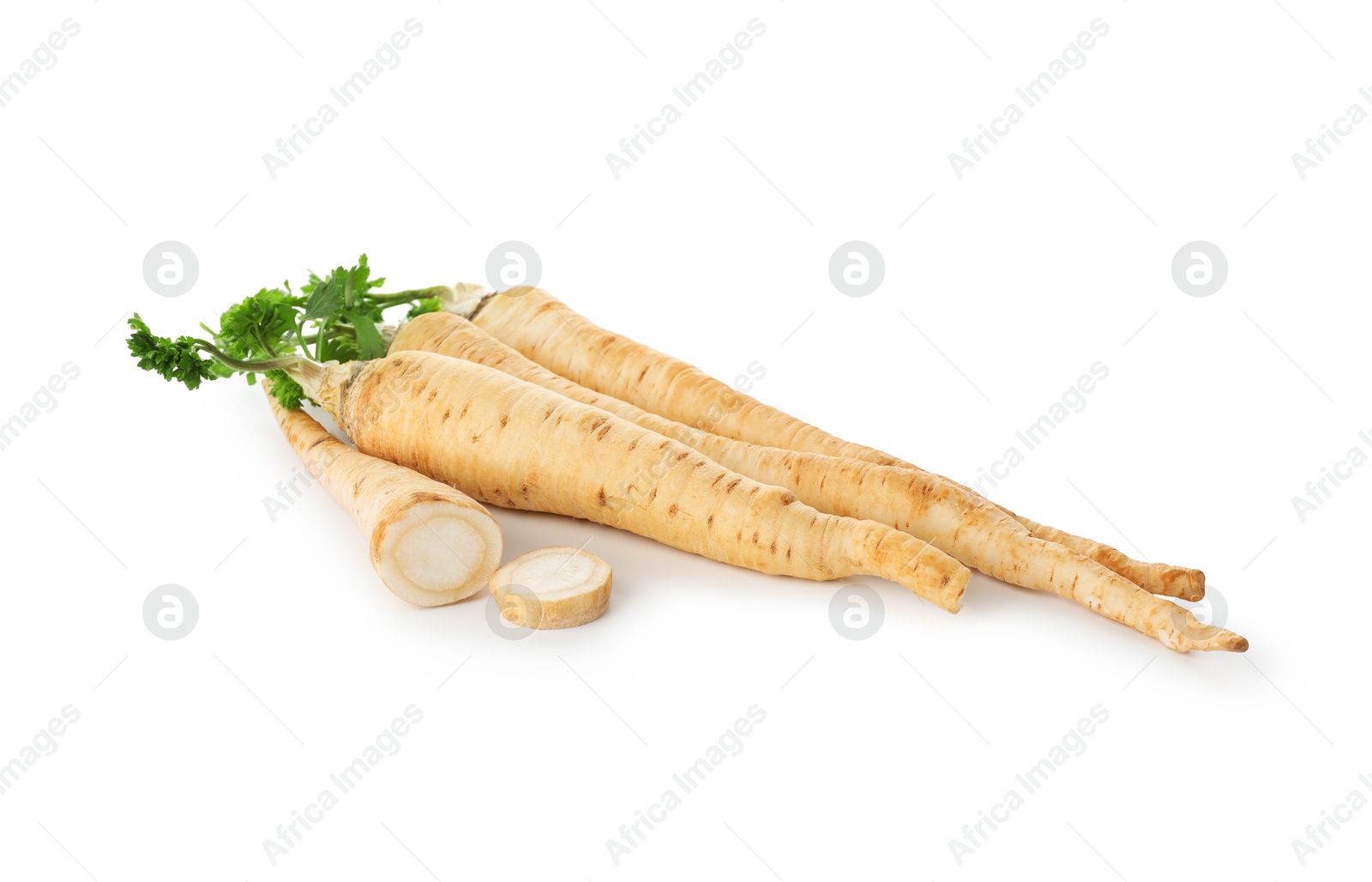 Photo of Whole and cut fresh parsley roots isolated on white