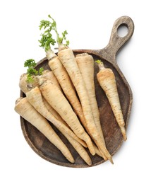 Photo of Many fresh parsley roots isolated on white, top view