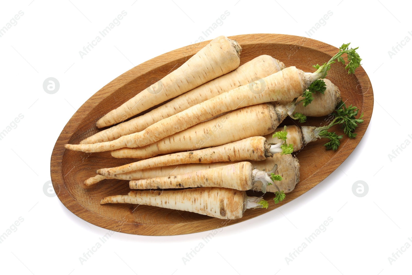 Photo of Many fresh parsley roots isolated on white, top view