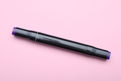 Photo of One double sided marker on pink background, top view