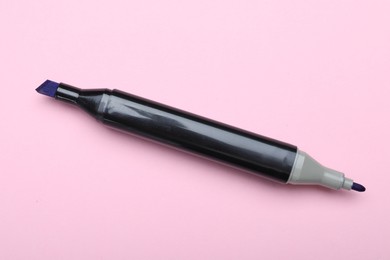 Photo of One double sided marker on pink background, top view