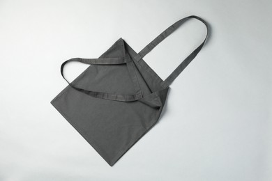 Photo of One shopping bag on grey background, top view. Mockup for design