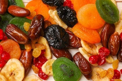 Photo of Mix of different dried fruits on table, top view