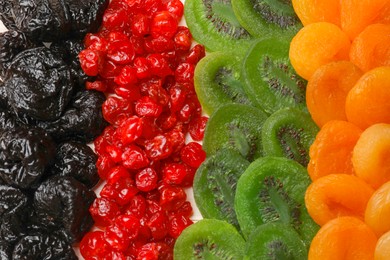 Photo of Mix of different dried fruits on table, top view