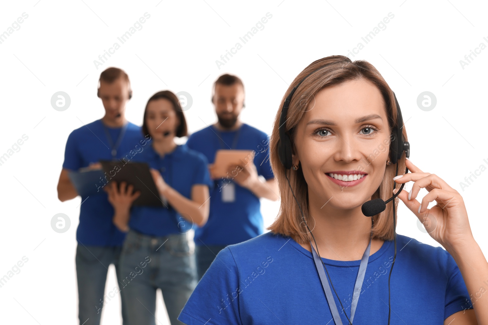 Photo of Technical support call center. Smiling operator on white background, selective focus