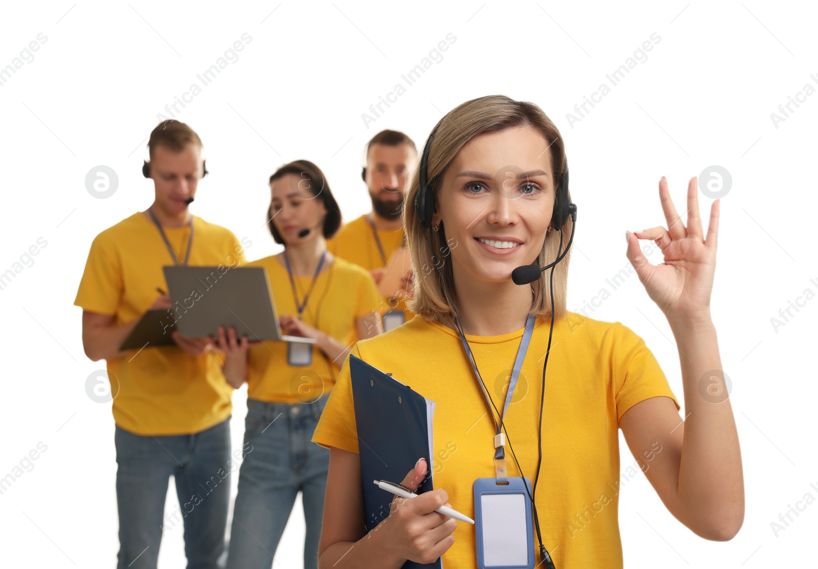 Photo of Technical support call center. Team of friendly operators on white background