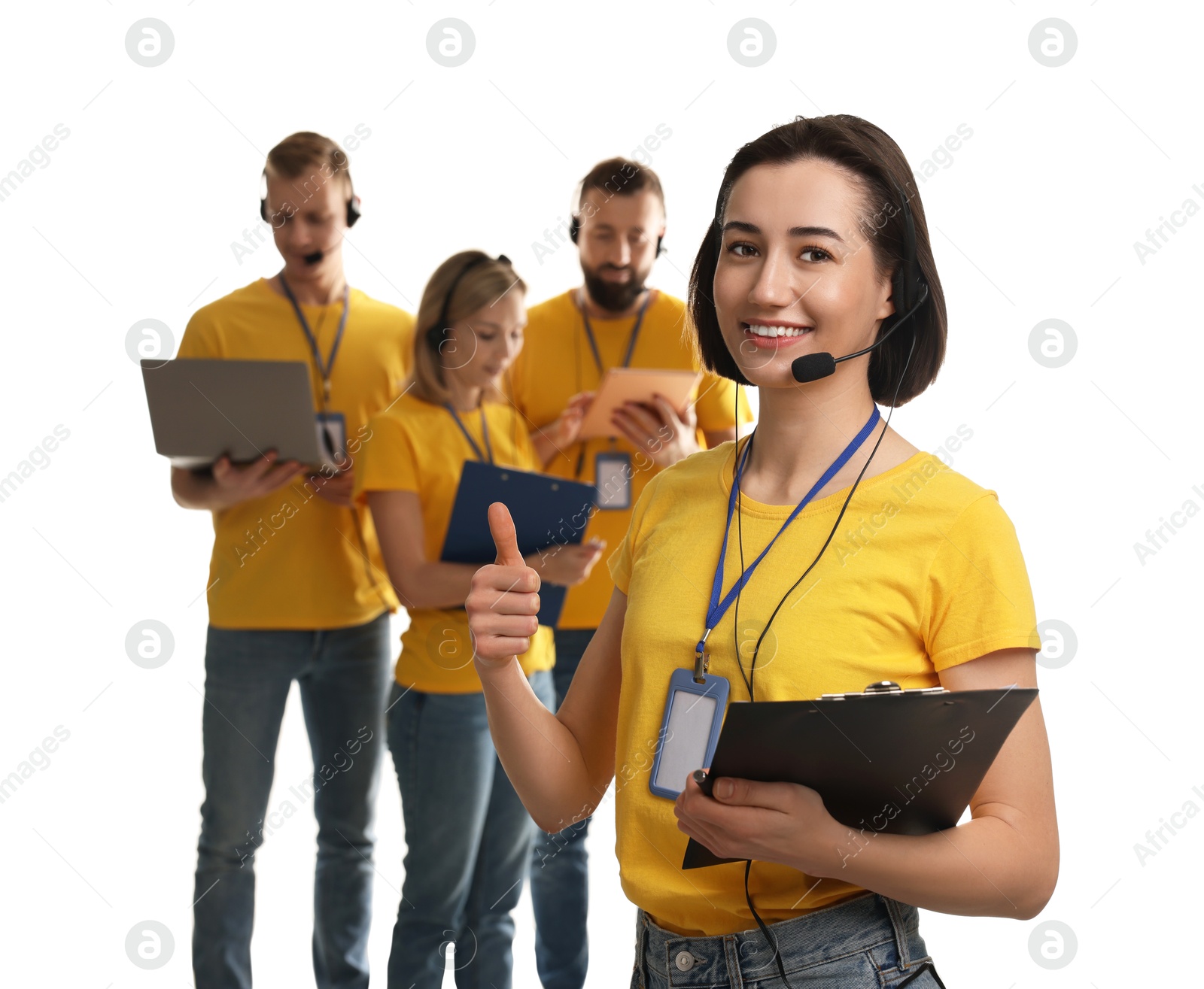 Photo of Technical support call center. Team of friendly operators on white background