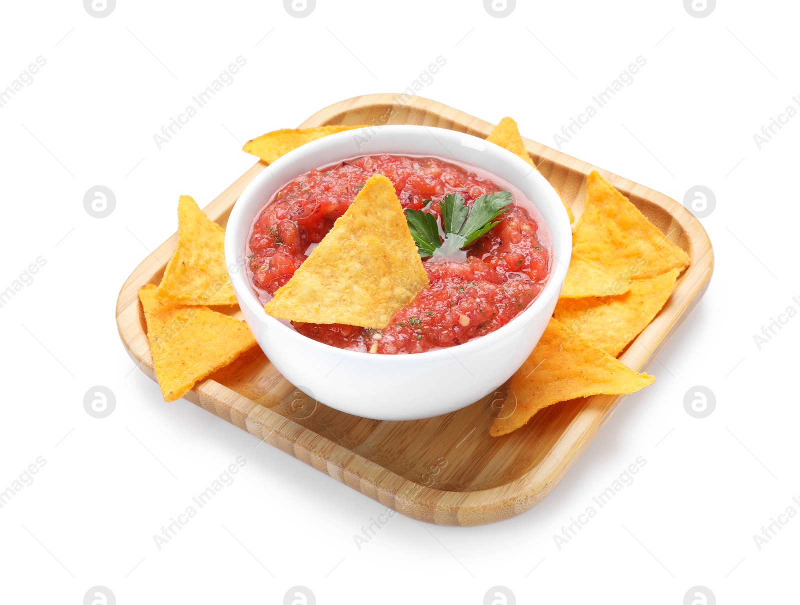 Photo of Delicious spicy salsa sauce in bowl and nacho chips isolated on white