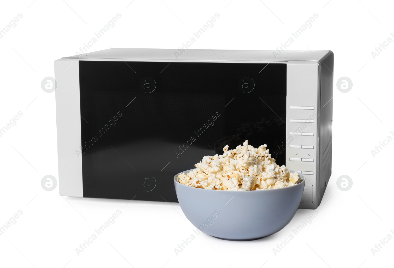 Photo of Bowl of popcorn and microwave oven isolated on white